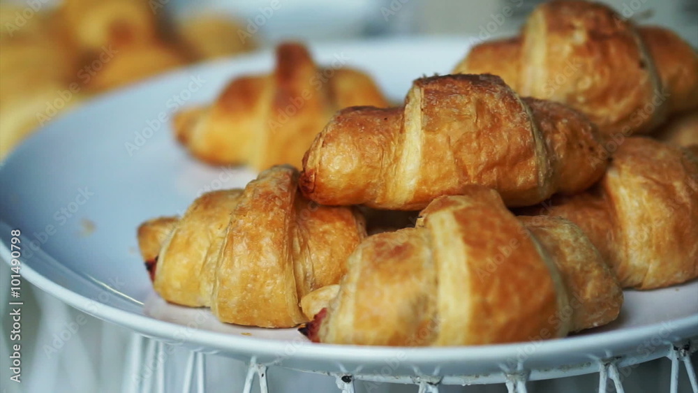video of pile of french croissants serving on plate video of pile of french croissants serving on plate