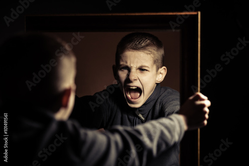 Angry Boy Shouting on his Own Mirror Reflection