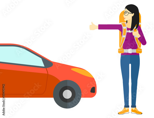 Young woman hitchhiking.