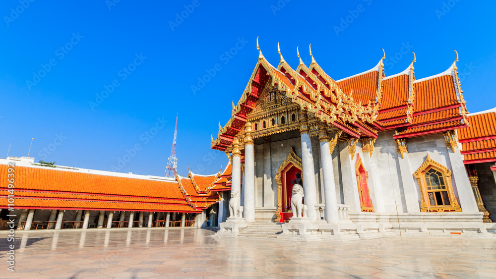 Naklejka premium Traditional Thai style Stucco & Naga, Wood Carving Tympanum of Thai Roof Temple at Wat Benchamabopit Dusitvanaram in Bangkok, Thailand