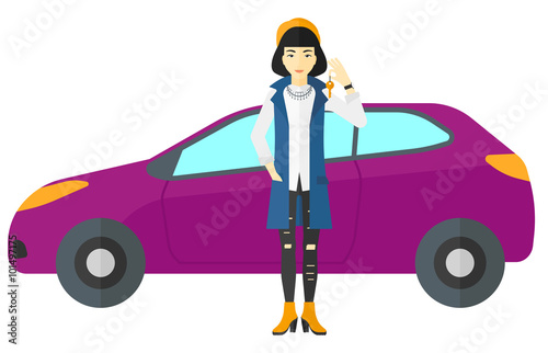 Woman holding key from new car. © Visual Generation