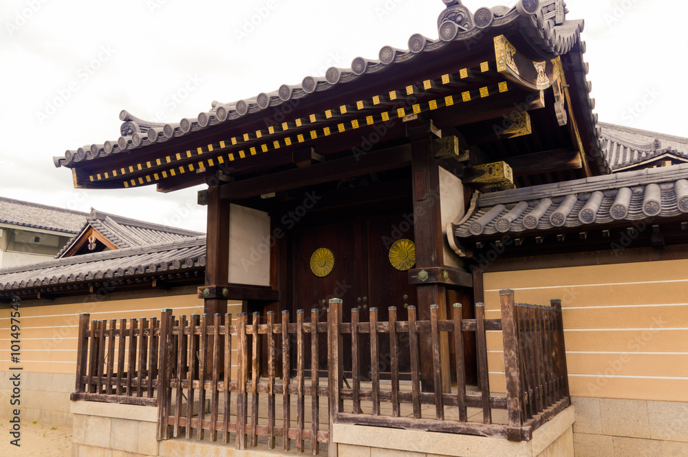 Old gate in Japan.Mud walls, tile