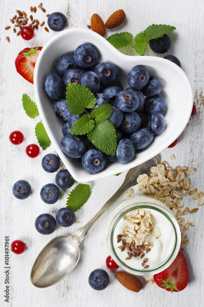 Healthy breakfast of muesli, berries with yogurt and seeds Healthy breakfast of muesli, berries with yogurt and seeds