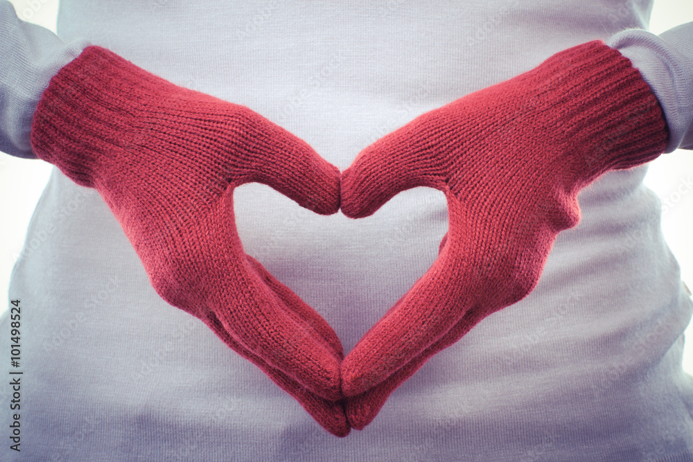 Vintage photo, Hand in woolen gloves arranged in shape of heart, symbol of love