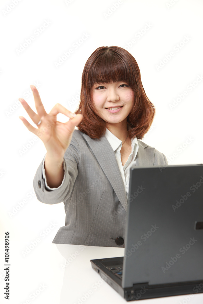 young Japanese Business woman showing perfect sign young Japanese Business woman showing perfect sign
