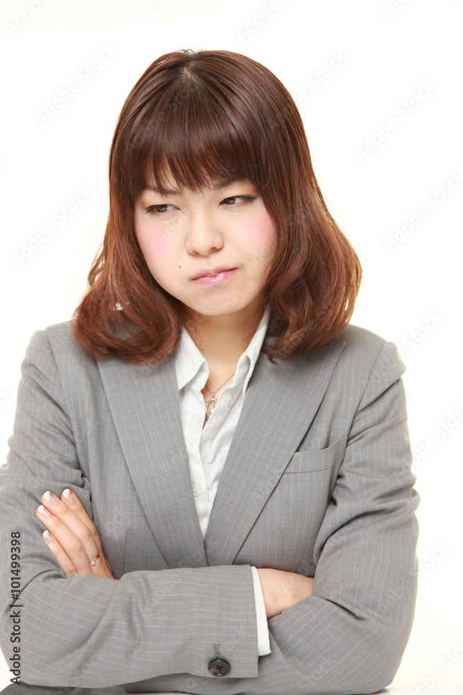young Japanese businesswoman worries about something young Japanese businesswoman worries about something