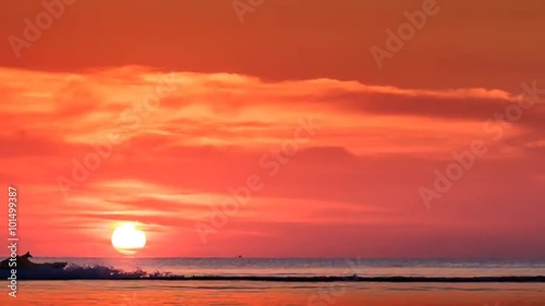 Motorboat Drifts Fast Sunlight Reflection Sundisk at Sunset photo