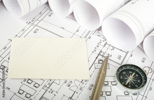 Blank card with pen on blueprint