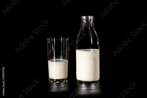 cow's milk in a glass bottle or glass