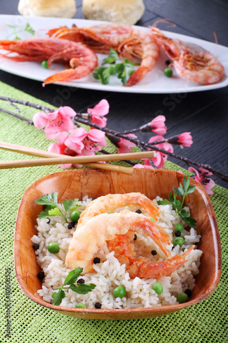 Batter prawn served with white rice and peas photo