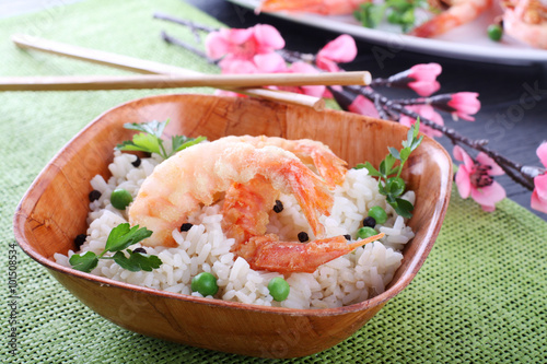 Batter prawn served with white rice and peas photo