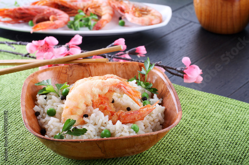 Batter prawn served with white rice and peas