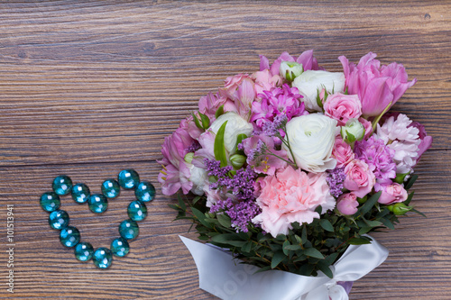 Fototapeta Naklejka Na Ścianę i Meble -  Valentine flowers on with heartshaped jewellery