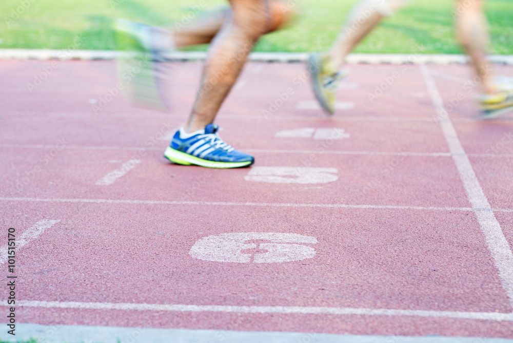 Runners feet in motion on track