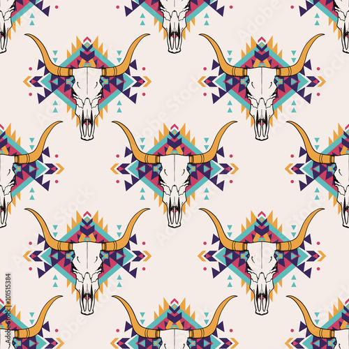 Vector tribal seamless pattern with bull skull and decorative ethnic ornament. Boho style. American indian motifs.