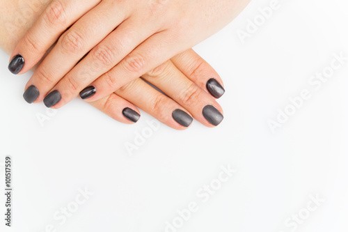 Woman hands with grey nails