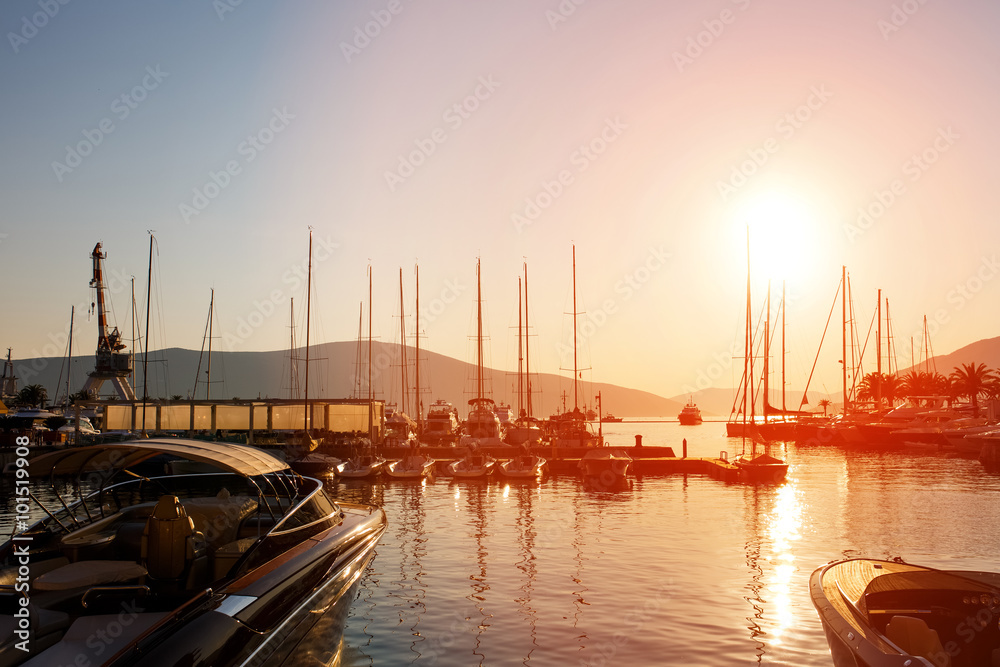 Yachts and boats at Adriatic sea bay at sunset in golden and pink tones. Yachts and boats at Adriatic sea bay at sunset in golden and pink tones.