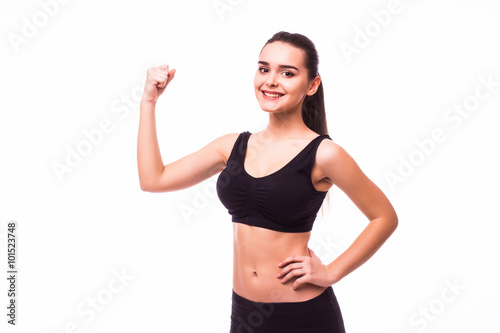 Portrait of beautiful young sporty muscular woman. Isolated over white background