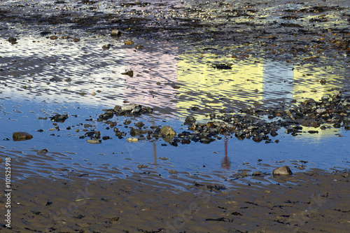 Reflections of the Changing Huts on Chalkwell Beach, Essex, Engl