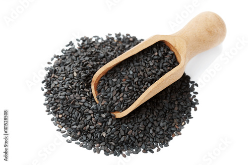 Black sesame seeds isolated on white background, top view