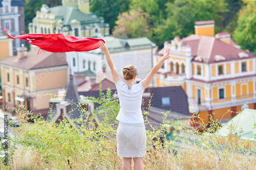 Free happy woman waving a red handkerchief © timonko