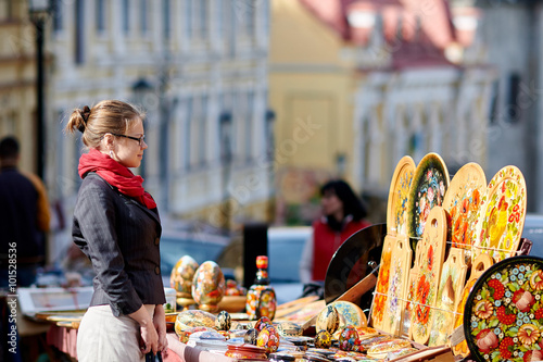 young woman looking at the goods on Andrew's descent, Kiev, Ukra photo