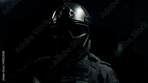 Special forces soldier with a gun close up