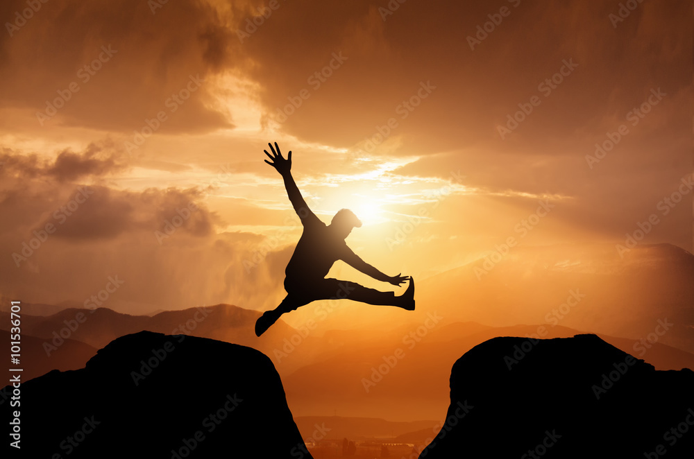 silhouette of man jumping