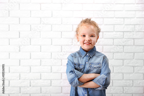 Little girl in jeans suit o...