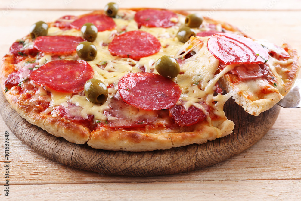 Delicious tasty pizza with cut slice, closeup Delicious tasty pizza with cut slice, closeup