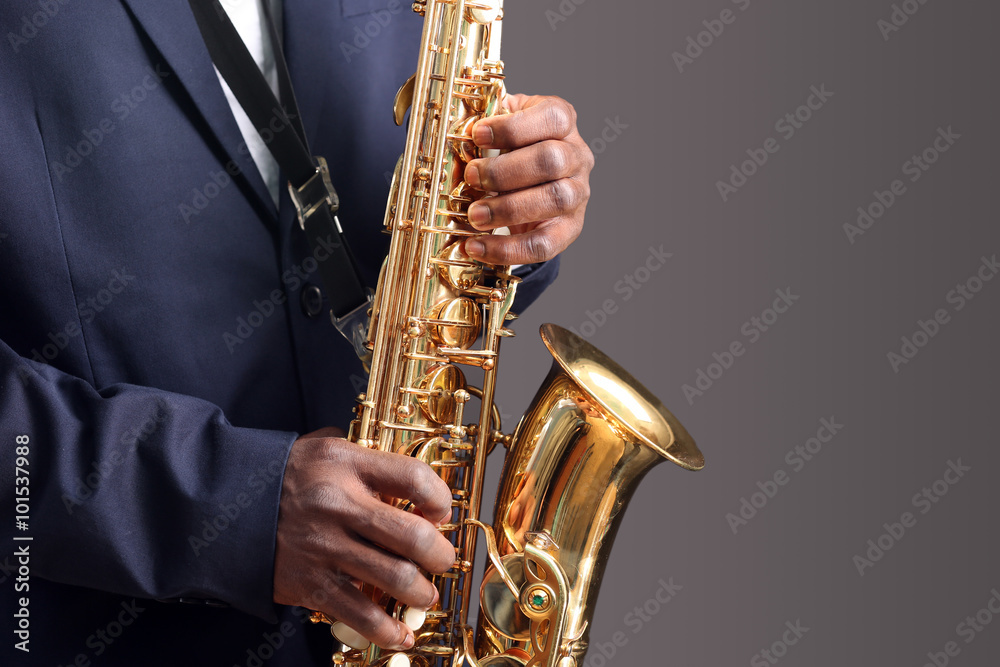 Obraz premium African American jazz musician playing the saxophone, closeup