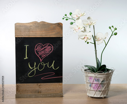 Love and romance concept. Valentine's day text written on a chalkboard