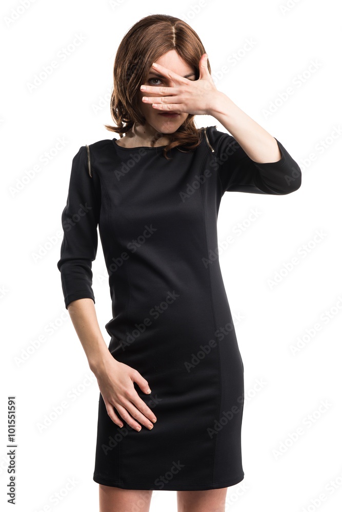 Brunette woman covering her eyes Brunette woman covering her eyes