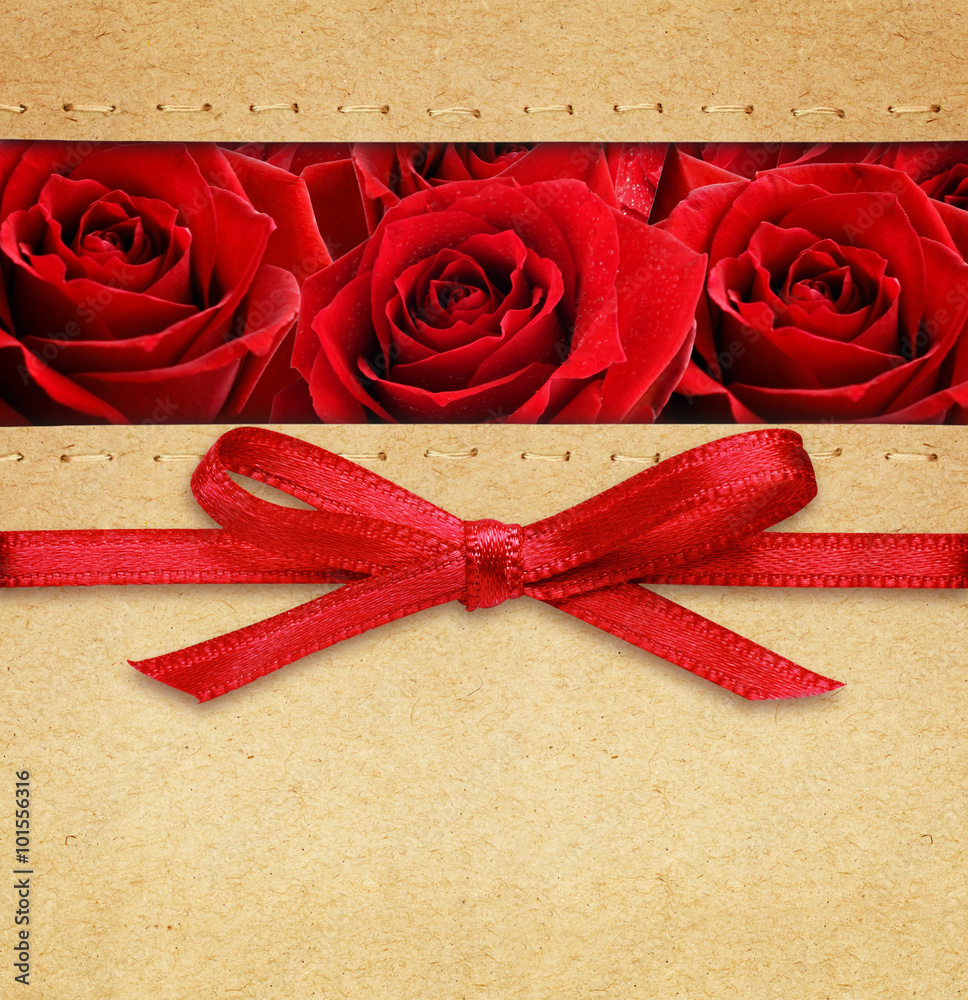 Roses and red bow on carton - obrazy, fototapety, plakaty 