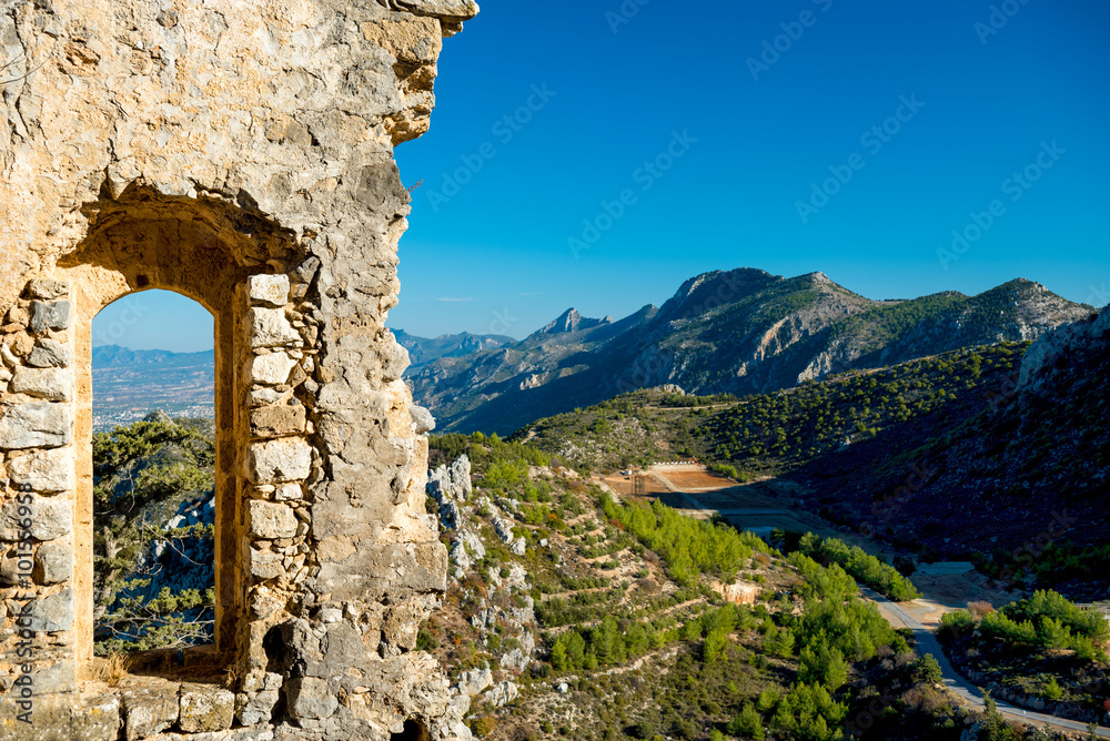 Ruined castle window with a mountain view