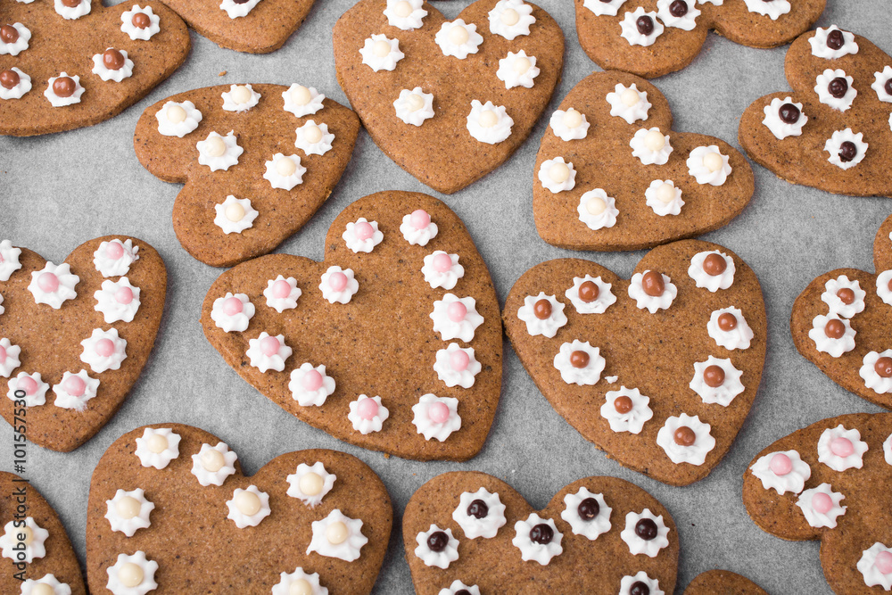 Heart shaped cookies on baking paper background Heart shaped cookies on baking paper background