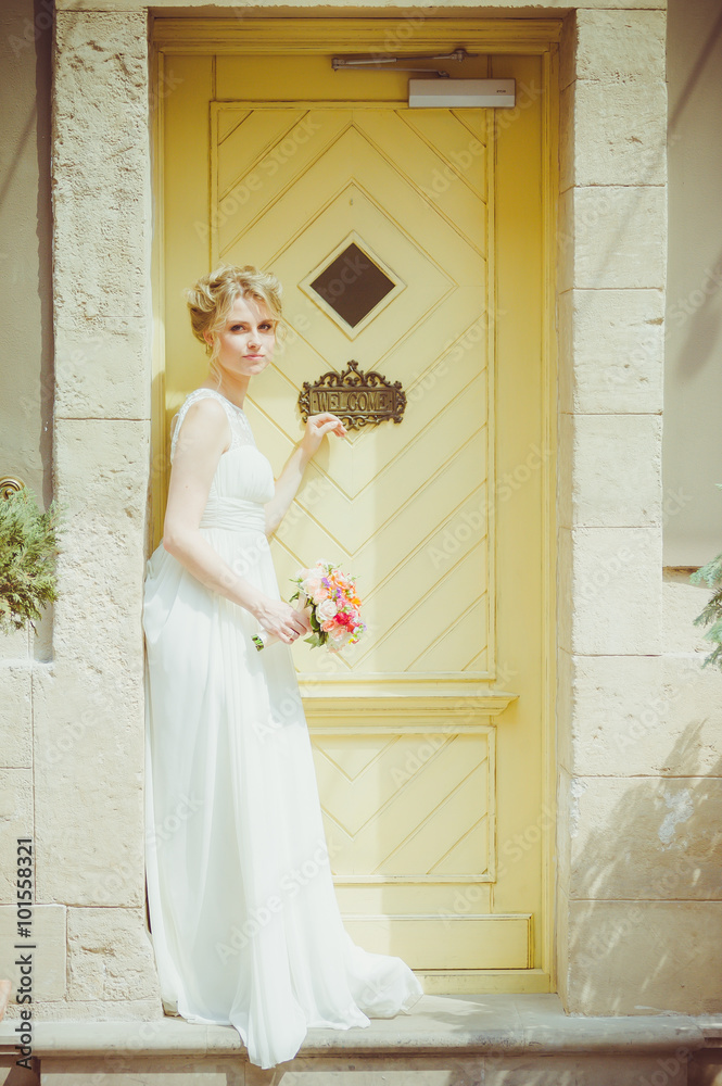 Fototapeta premium Beautiful bride with bouquet before wedding ceremony