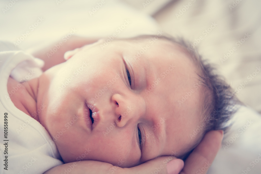 newborn baby lying on mother's hands symbolizing tenderness and care newborn baby lying on mother's hands symbolizing tenderness and care