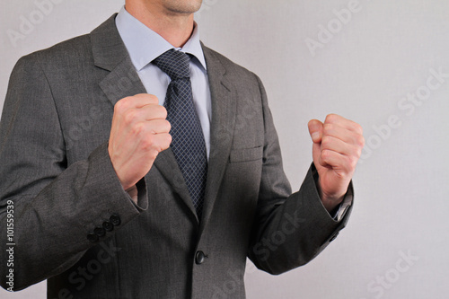 Accomplish yes: Businessman showing symbol of success close up .Winner concept