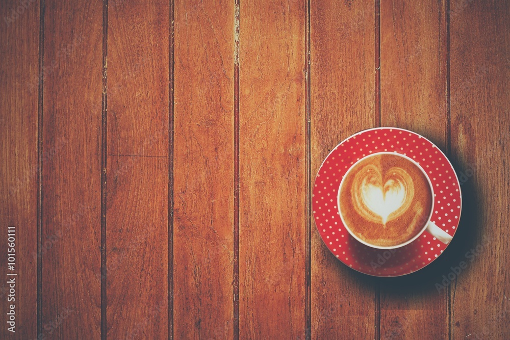 cup of coffee on the wooden desk cup of coffee on the wooden desk