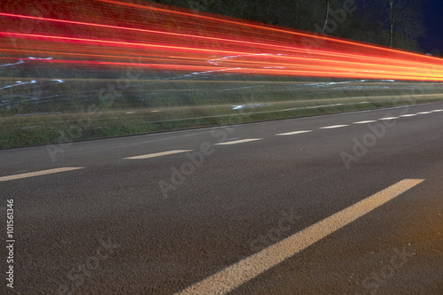 Car lights on road at night