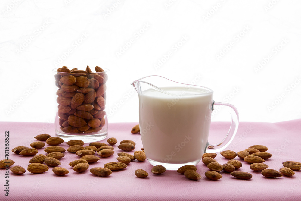 Almond milk with almond on a table, lactose free Almond milk with almond on a table, lactose free