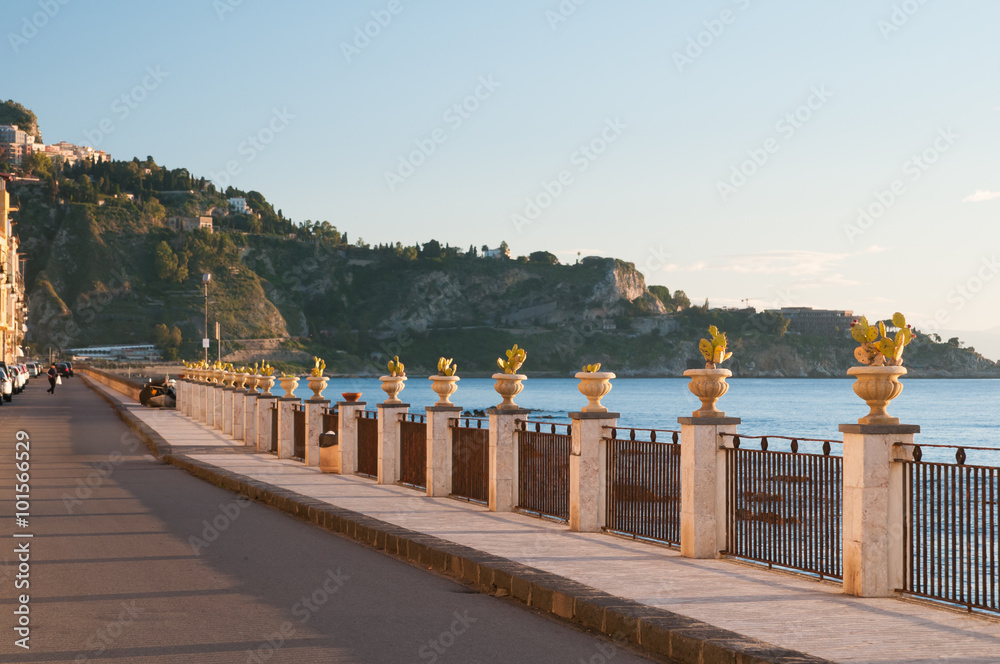 View of some ornamental vases with a cactus plant along the seafront of the touristic village Giardini Naxos, Eastsicily