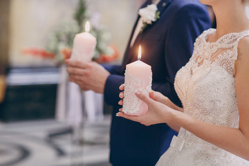hands candle church wedding
