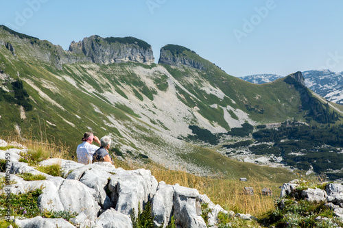 The tourists watching the Alps