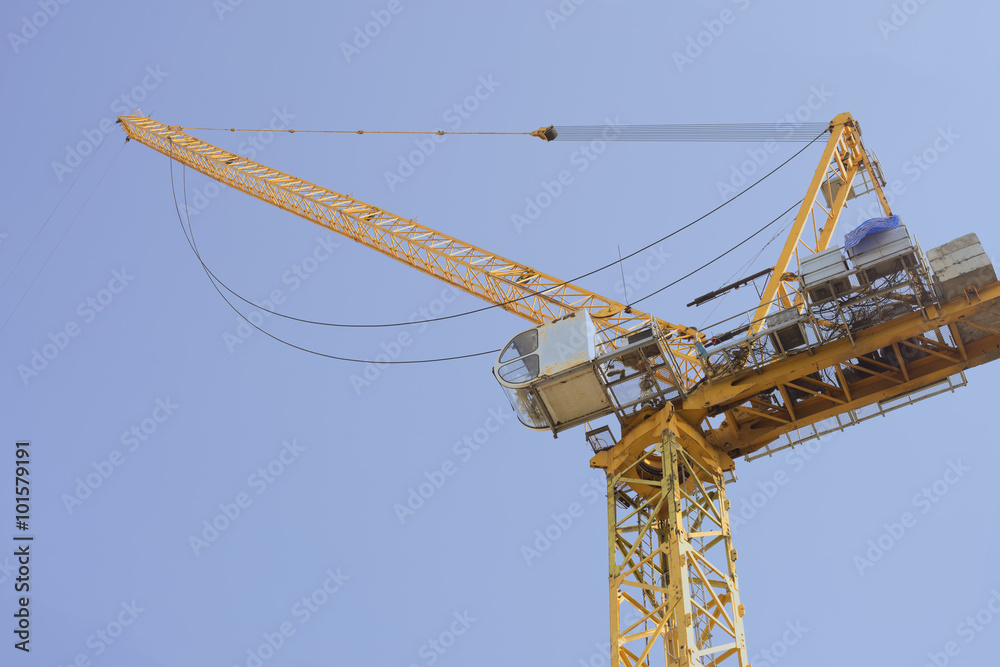 construction cranes and the blue sky with clouds construction cranes and the blue sky with clouds