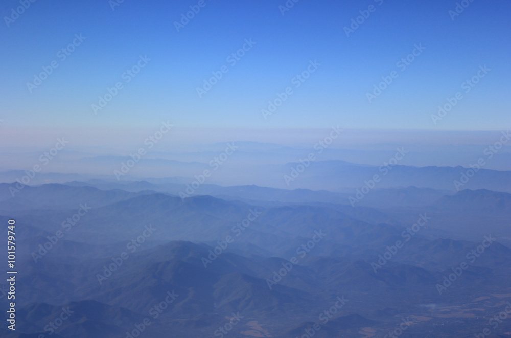 Dramatic mountain with deep blue sky and layered hills in the distance
Mountain landscape in North of Thailand