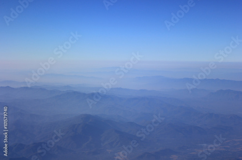 Dramatic mountain with deep blue sky and layered hills in the distance  Mountain landscape in North of Thailand
