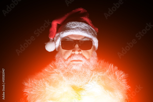 Scary and evil Santa Claus in sunglasses