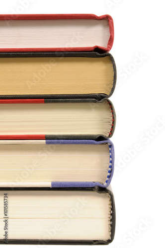 Small stack of hardback textbook books isolated on white background photo